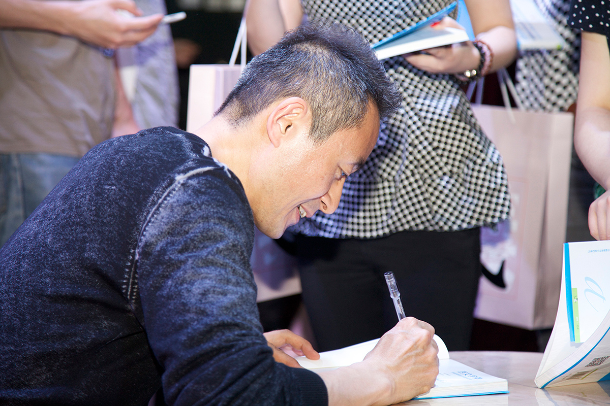 Kobayshi was signing his book.